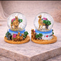Snow globe with camel scene